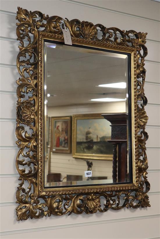 A 19th century Florentine carved and pierced giltwood wall mirror, W.2ft 3in. H.2ft 7in.